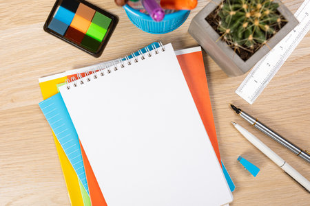 Back to school concept. Top view photo of notepads, pens, sharpeners, ruler, staplers, clips,...