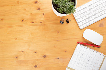 Calendar and agenda reminders, work from home online. desktop calendar with stationery and pen pencil, keyboard. mark a holiday trip or plans in a diary at the office desk. 2023 calendar reminder concept.の写真素材