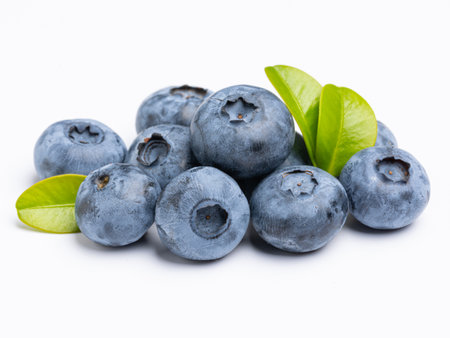 Fresh blueberries with blueberry leaves isolated on white background. view from above. Fresh raw berriesの写真素材