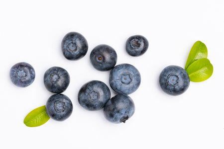 Fresh blueberries with blueberry leaves isolated on white background. view from above. Fresh raw berriesの写真素材