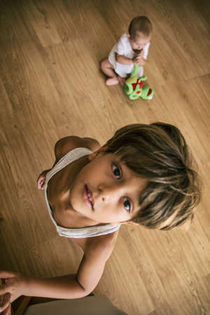 Cute boy looking at camera Stock photo of cute child looking up and looking at camera while at home. Zenith planeの写真素材
