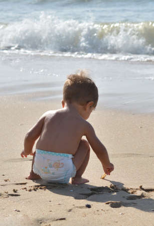 Beautiful Child Playing On The Beach. Summer vacationの写真素材