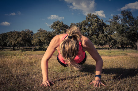 Athletic Woman Training On The Field. Woman Running In The Field, Individual Activity. Lifestyle Of...
