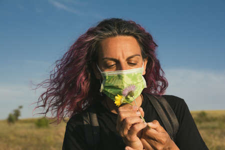 Woman With A Sanitary Mask After The  Outbreak In Spain. Adult Woman In The Field Enjoying Nature...