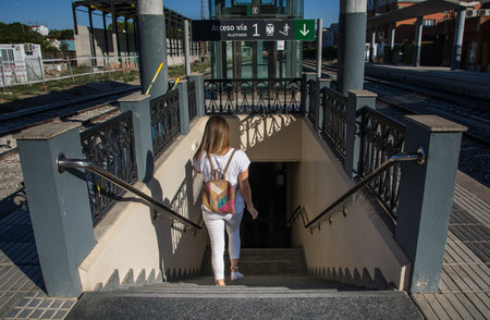 Young Woman In An Underpass. Girl in an underpass at the railway station. Travelの写真素材
