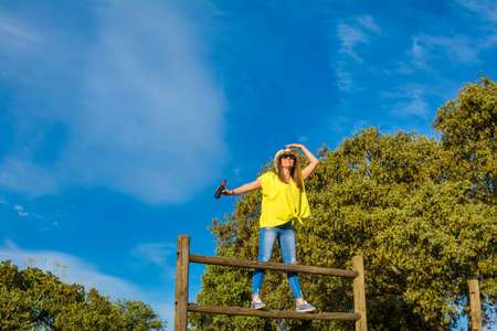 Portrait One Of Woman Celebrating Spring At Nature Fields. She Has A Bottle Of Beer And A Cowboy...