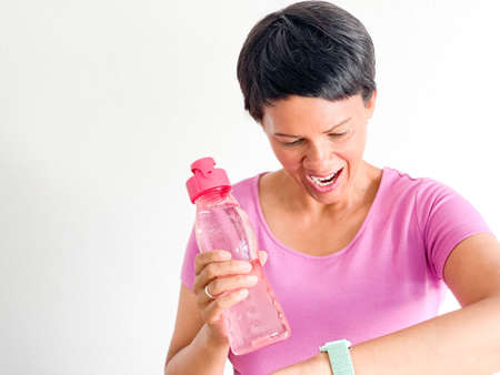 Brown woman with water bottleの写真素材
