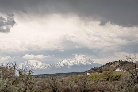 Cold Colorado sky over frozen icy mountainの写真素材