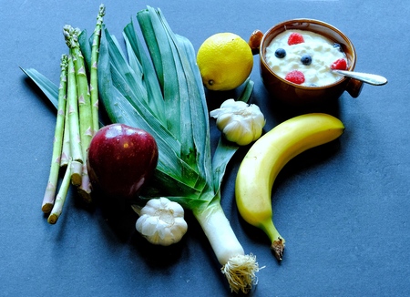Selected prebiotic and probiotoc foods on blue background
