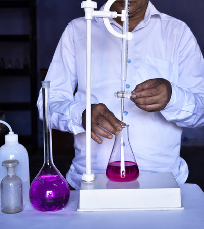 Scientist performing titration in chemistry laboratory. Redox Titration with color solution in chemistry Lab.の写真素材