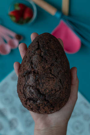 Delicious Easter egg stuffed with chocolate and strawberries. Top view.の写真素材