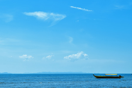 Blue sea beach with canoeの写真素材