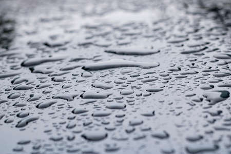 Raindrops on a car's surfaceの写真素材
