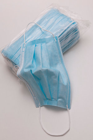Blue surgical masks to prevent contagionの写真素材