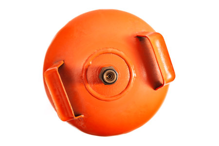 On a white background, top view of an orange butane gas cylinder, showing the valve and the handles to hold it.の写真素材
