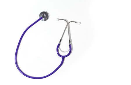 Isolated stethoscope on white seen from above. The tubing is purple.の写真素材