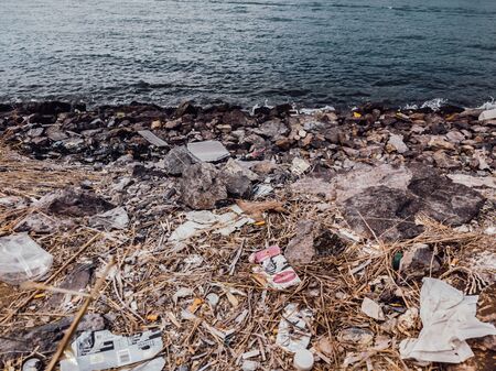 Environmental disaster, ecological pollution, garbage scattered on the ground waste near sea....