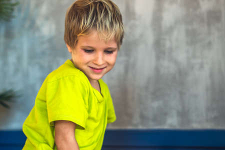 Portrait mischievous cute blond blue eyed boy making freckles face play laughing in happy mood. Funny photo, happiness lifestyle. Daycare, simple joys happy childhood, behaviour education psychologyの写真素材