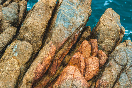 Close up view bright vivid orange brown yellow stone rock shabby