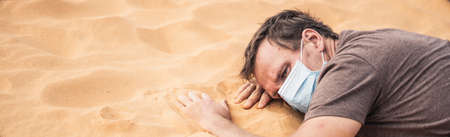 BANNER Close-up side portrait man wear mask, face expression emotion, lies on stomach arms crossed...