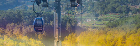 BANNER Circulat cable car between Dalat bus station and Robin Hill Truc Lam Vietnam. Intermediate...