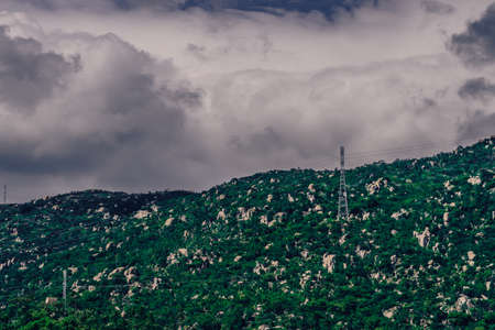 Real nature landscape background. Rocky mountain, cloudy Pale Blue dark stormy sky autumn day, high...