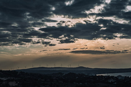 Abstract background sky Dawn Sunset Contrast dark shadow bright cloud sun orange silhouette above the mountains near the seaの写真素材