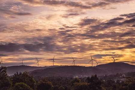 Abstract background sky Dawn Sunset Contrast dark shadow bright cloud sun orange silhouette above the mountains near the seaの写真素材
