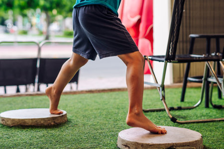 Boy acrobatic movements, standing on hand feet wide steps, feel free to be yourself in any placeの写真素材