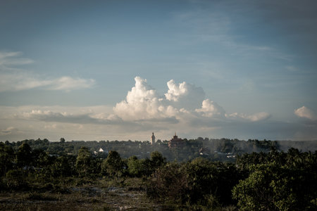 Atmosphere panorama cumulus white clouds over buddhist temple statue. Dramatic Sky Sunset Meditationの写真素材