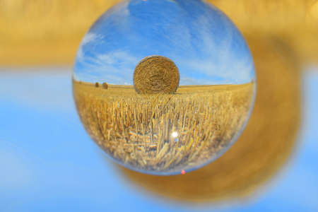 Straw roll captured through crystal ball