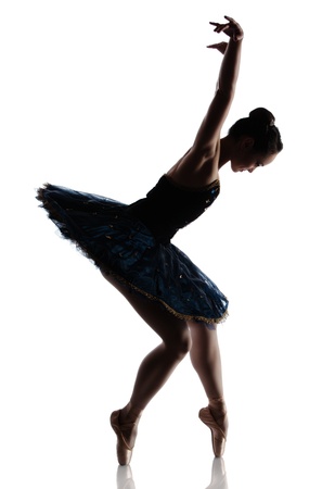 Silhouette of a beautiful female ballet dancer isolated on a white background. Ballerina is wearing a royal blue tutu and pointe shoes.の写真素材