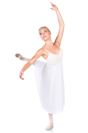 Beautiful female ballet dancer isolated on a white background. Ballerina is wearing a white feathered dress and pointe shoes.の写真素材