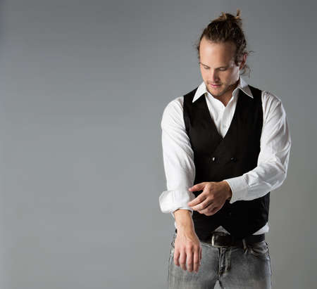 Portrait of a handsome caucasian man wearing a black jacket and white shirt.の写真素材