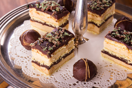 A selection of delicious desserts arranged and served on a silver cake stand in an english high tea style.の写真素材