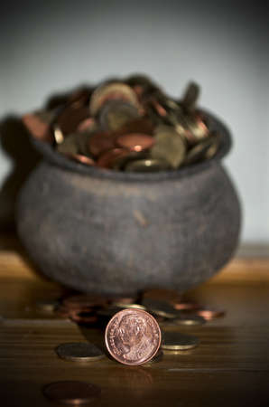 The Coins from around the world in the old black pottery isolated for collecting, business concept , Save money conceptの写真素材