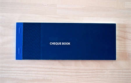 Cheque book, "Wooden background"の写真素材