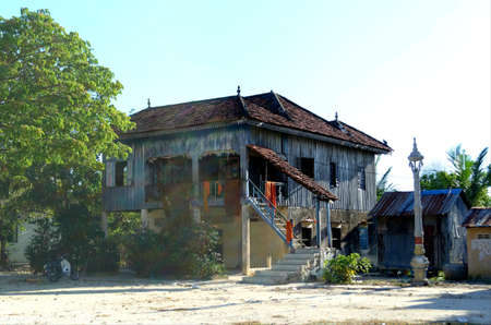 Khmer traditional wooden house, most of them is blue coloured, Klong Duan Keo, Takeo, Cambodiaのeditorial素材