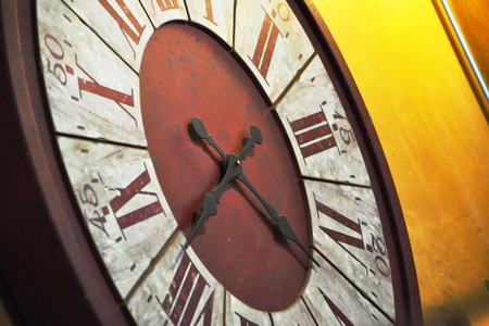 Big old clock hang on yellow wallの素材