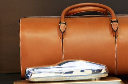 Bangkok - April 2 : mini model of Royce luxury car and brown leather bag with logo RR, in display at The 36th Bangkok international Motor Show 2015 on April 2, 2015 in Bangkok Thailandのeditorial素材