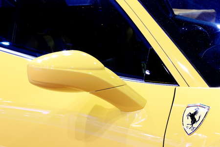 Bangkok - April 2 : -wing mirror of yellow Ferrari luxury sport car in display at The 36th Bangkok international Motor Show 2015 on April 2, 2015 in Bangkok Thailandのeditorial素材