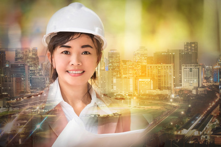 double exposure and soft focused , executive Asian engineer woman and cityscape scene , business...