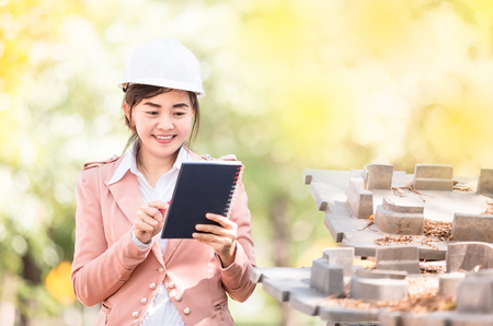 executive Asian engineer woman checking construction site , business environment engineer conceptの写真素材