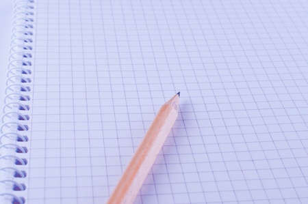 Pencil on open white paper notebookの写真素材