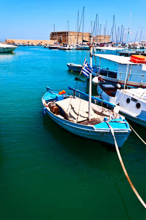 Boat on old fortress background Crete Greeceのeditorial素材