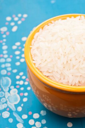 Rice in yellow bowlの写真素材