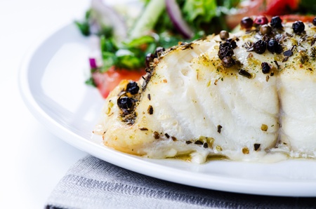 Grilled fish with salad close upの写真素材