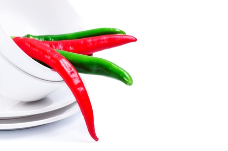 Chili peppers in bowl  close up isolatedの写真素材