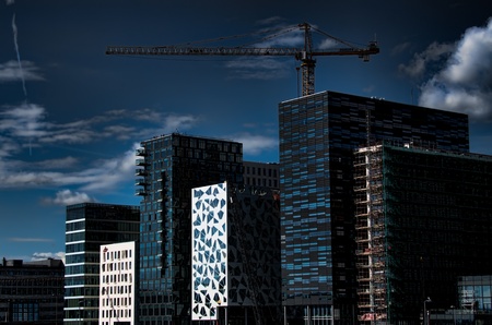 Modern building with cranes at duskのeditorial素材