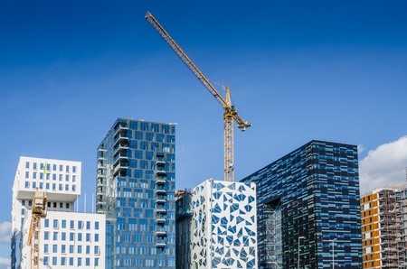 Construction site of modern building with cranes